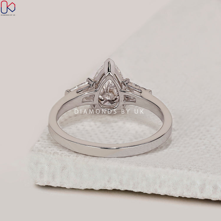 Lab grown diamond ring with 3 stone layout.
