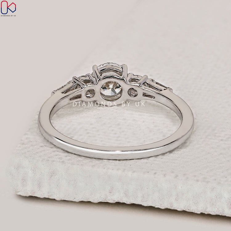 Lab grown diamond ring in a bright yellow gold band.
