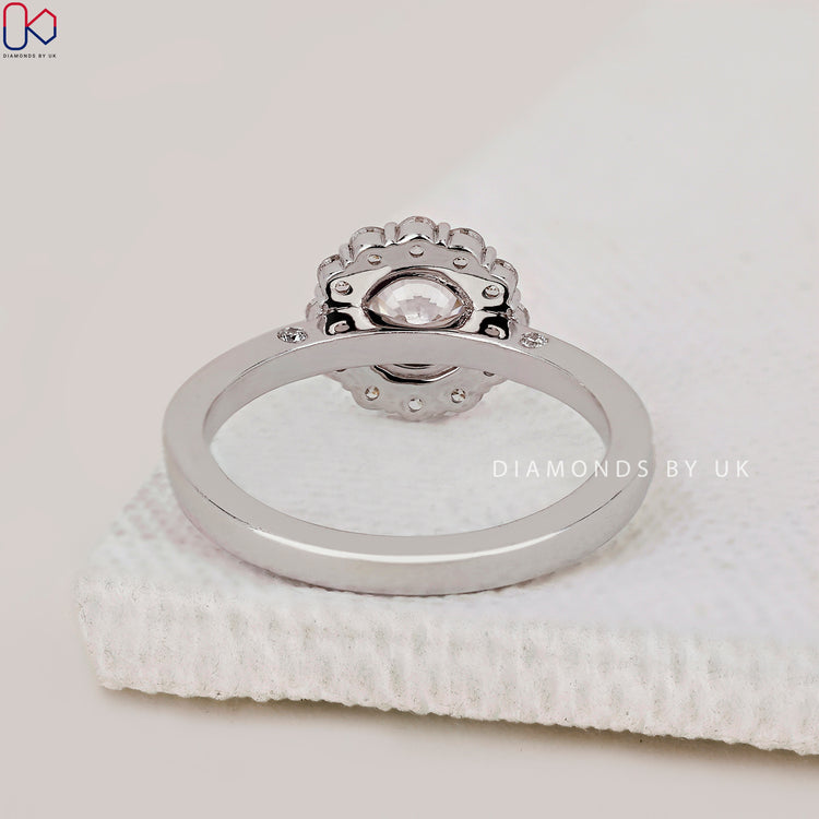 Diamondsbyuk engagement ring with pave setting and Halo design.
