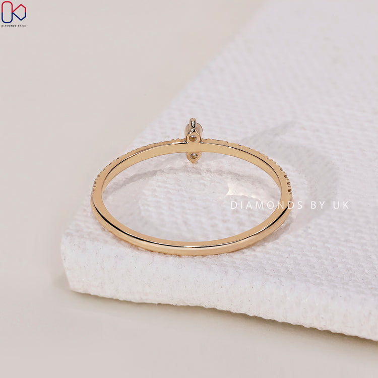 A prong set diamond band designed to enhance the brilliance of each gem.
