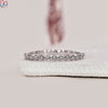 Half eternity band with diamonds set halfway around the band.
