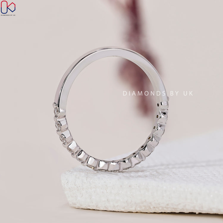 Diamond half eternity band designed for a sophisticated look.
