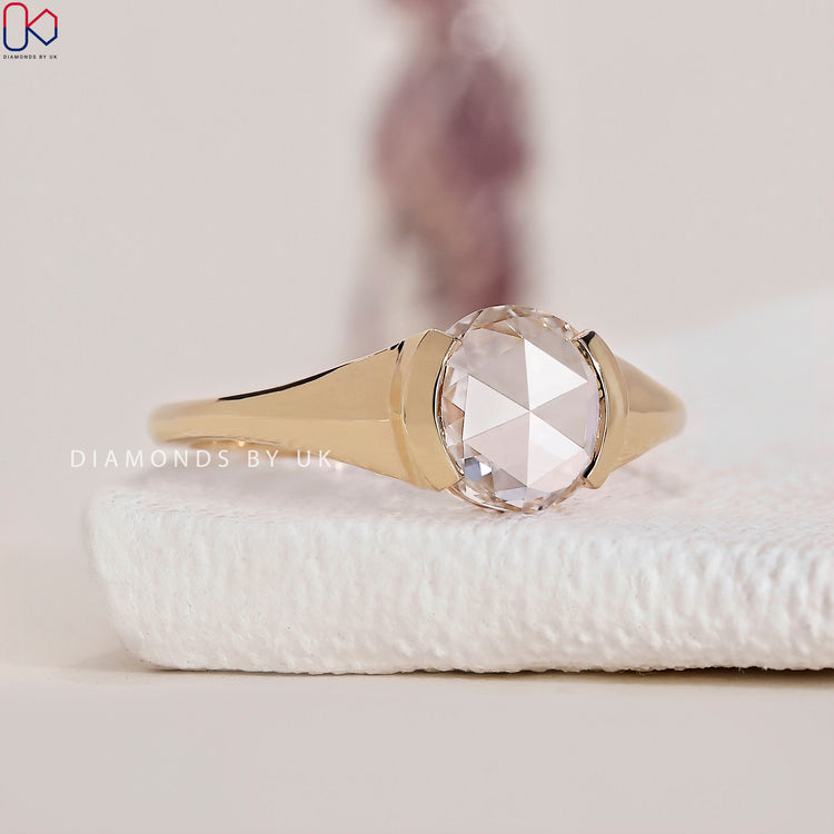 Yellow gold diamond ring with a captivating rose cut diamond.