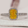 Yellow diamond ring with radiant cut centre stone.
