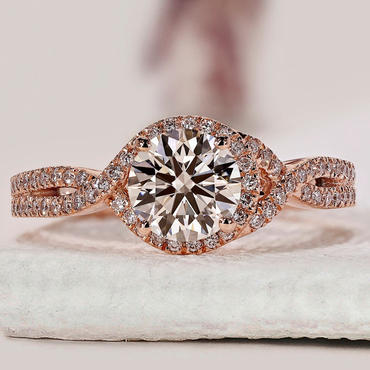 Rose gold engagement ring with round cut diamond.
