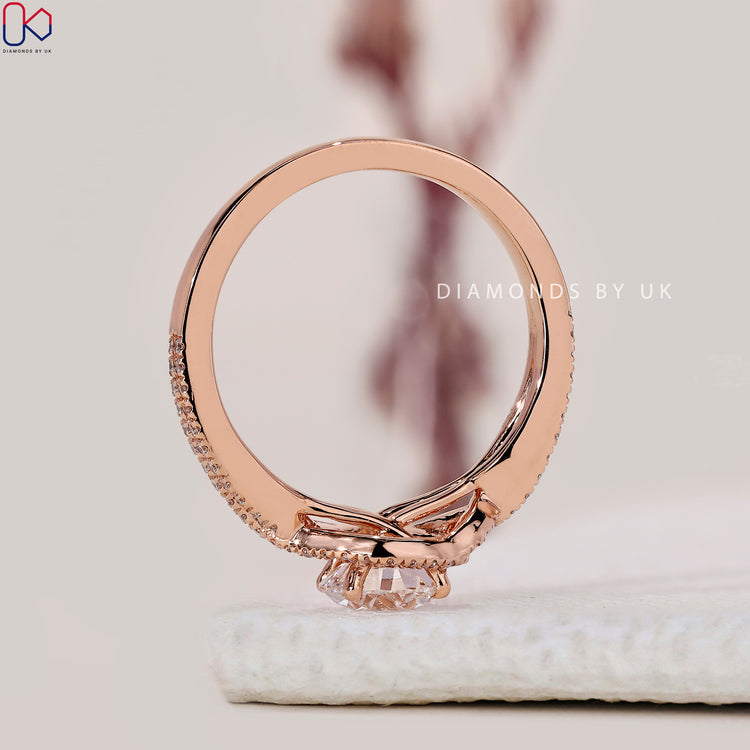 Buy engagement ring with twisted halo and pave band.
