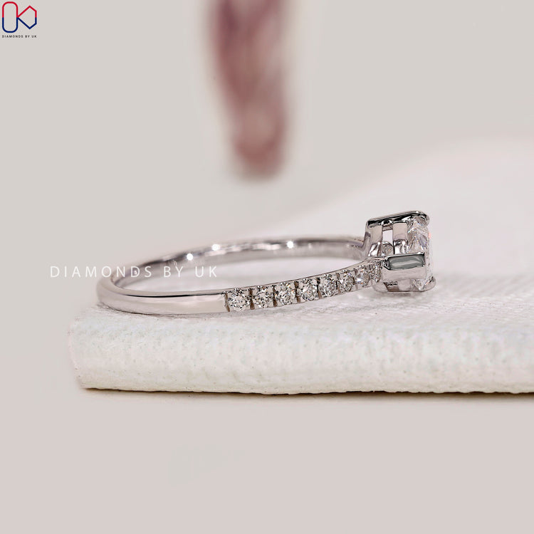 White gold engagement ring with pave diamond design.
