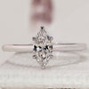 Marquise cut engagement ring with solitaire engagement ring.
