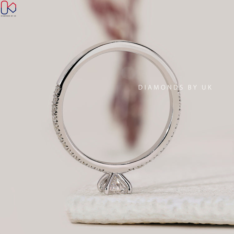 Buy engagement ring with V prong and pave setting.
