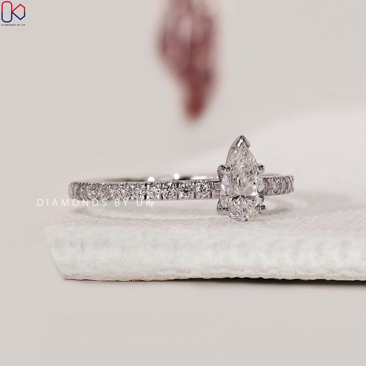 Round cut pave setting on white gold band.
