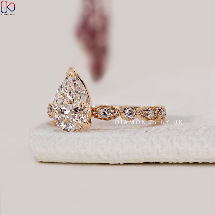 V prong setting ring featuring pear shaped diamond.
