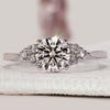 Round diamond engagement ring with muse set ring.
