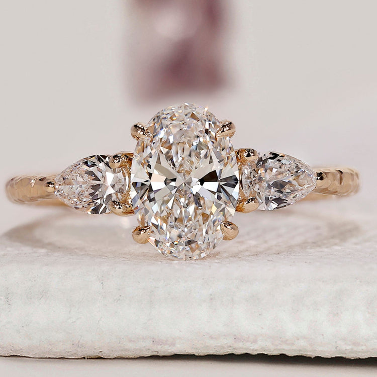 3 Stone Diamond Engagement Ring In Oval And Pear Cut Stone