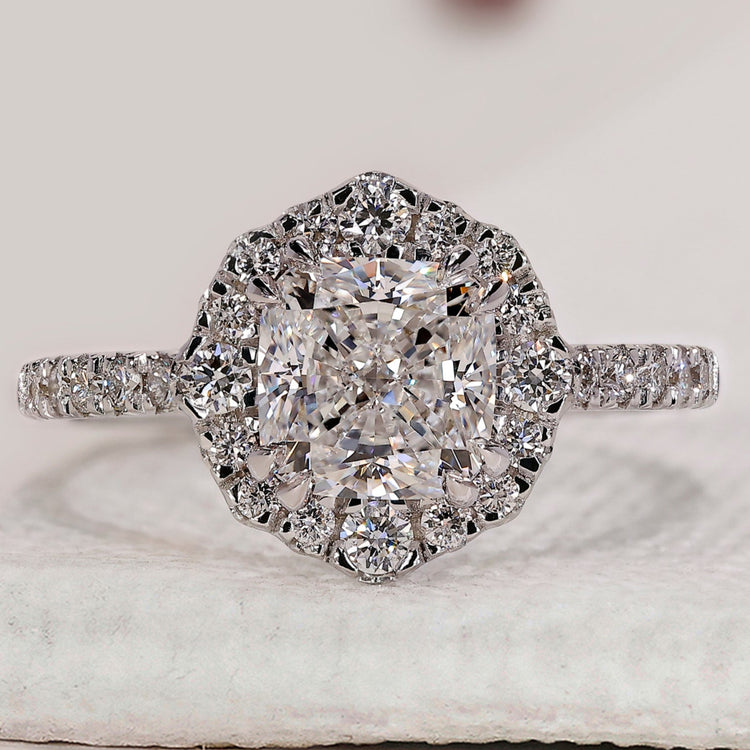 Cushion cut engagement ring with halo set ring.

