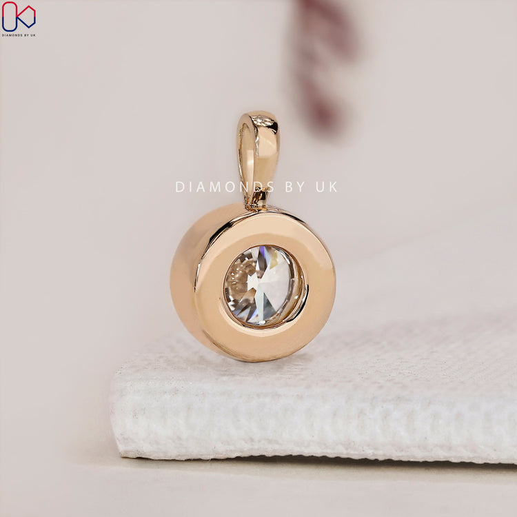 Lab-grown diamond pendant in a bezel set design.
