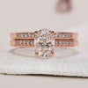 Oval engagement ring with wedding band featuring Lab Grown Diamond.
