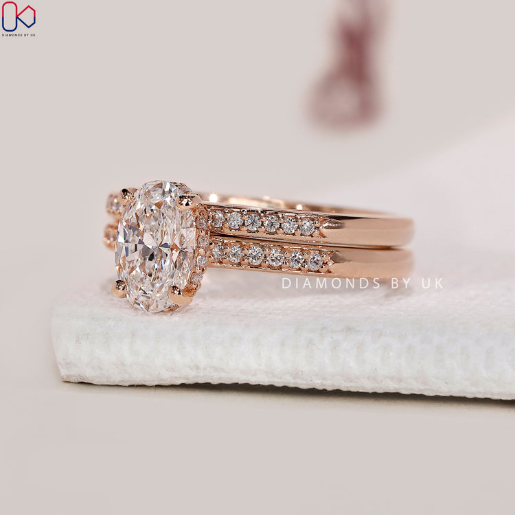 Pave setting ring featuring round diamond band in rose gold.
