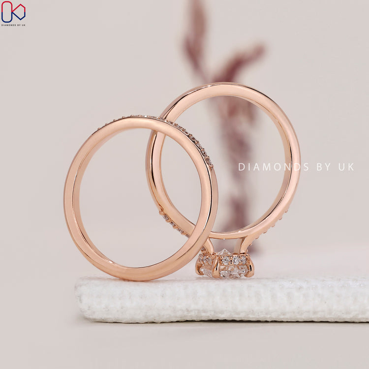 Buy bridal set featuring oval engagement ring and pave setting.
