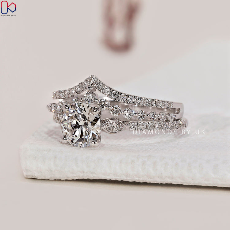 Prong setting ring in a custom bridal set with curved wedding band.
