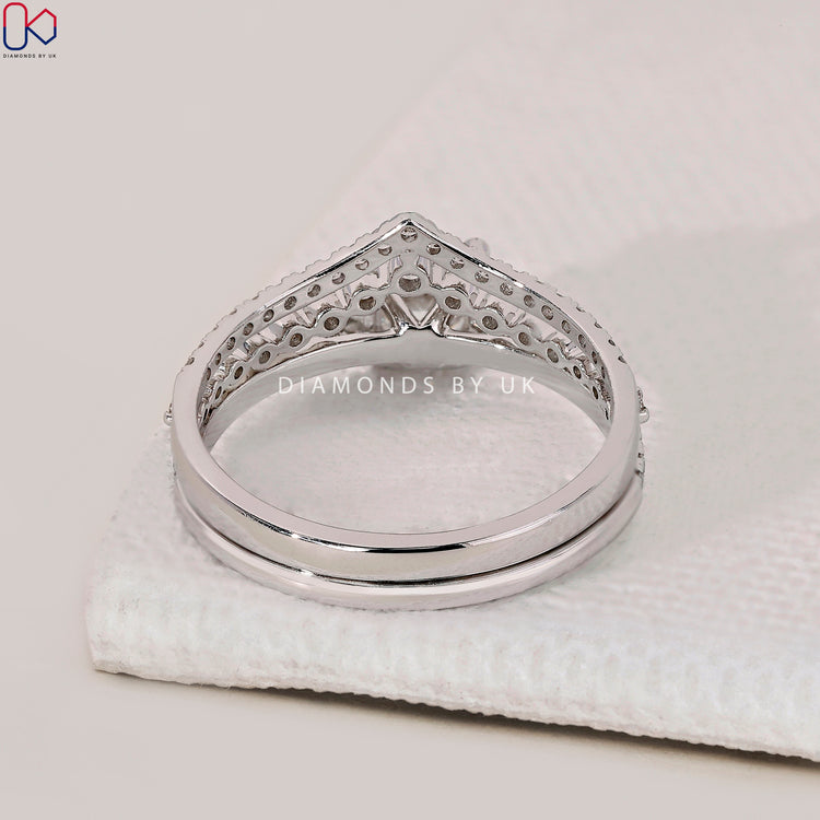 Half eternity diamond band in a white gold bridal set with round diamond ring.

