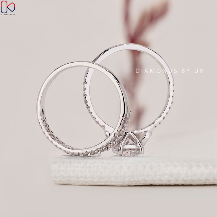 Handmade jewellery with pave setting ring and curved wedding band.
