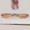 Half eternity band with round cut diamonds.
