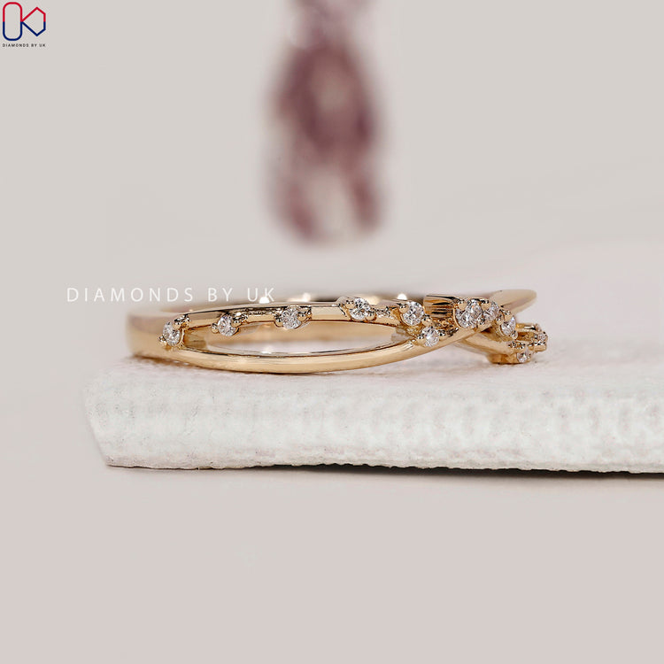 Prong set wedding band with diamonds.
