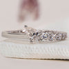 Pear diamond wedding band for a graceful look.
