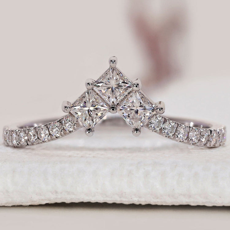 Princess cut and round diamond band in a handmade wedding design.