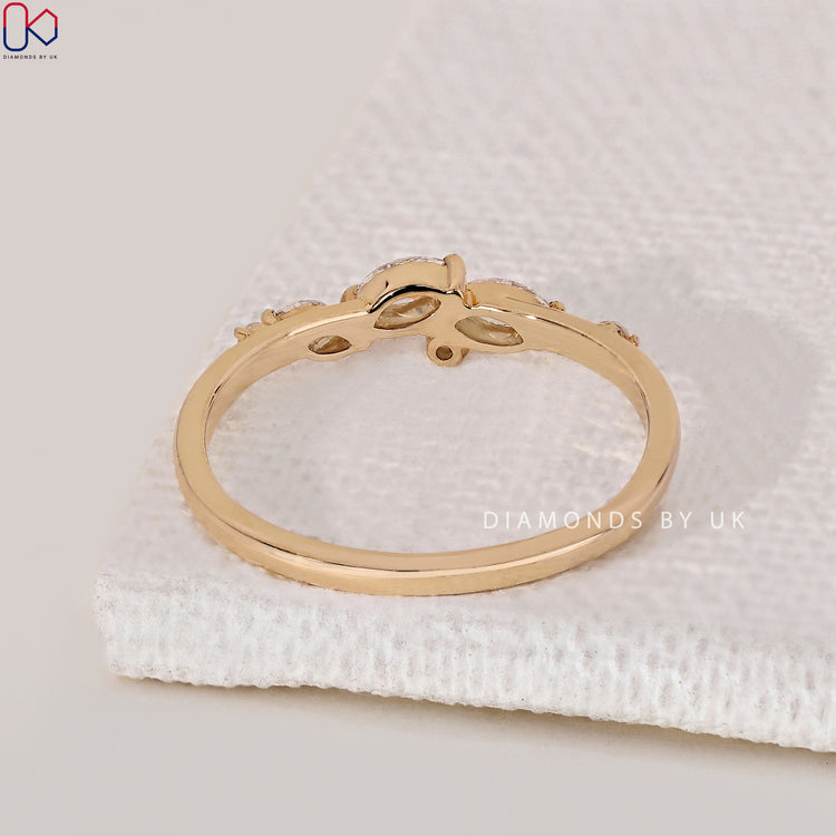 Diamondsbyuk band features marquise and round wedding band.