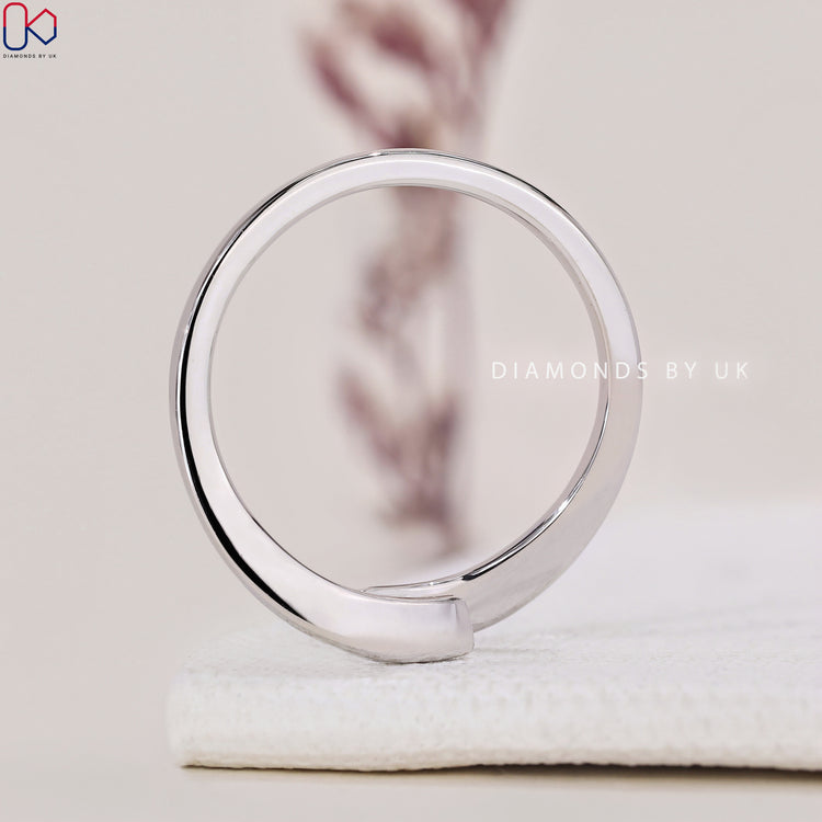 Handmade ring featuring a beautiful round cut diamond ring set in a white gold ring.
