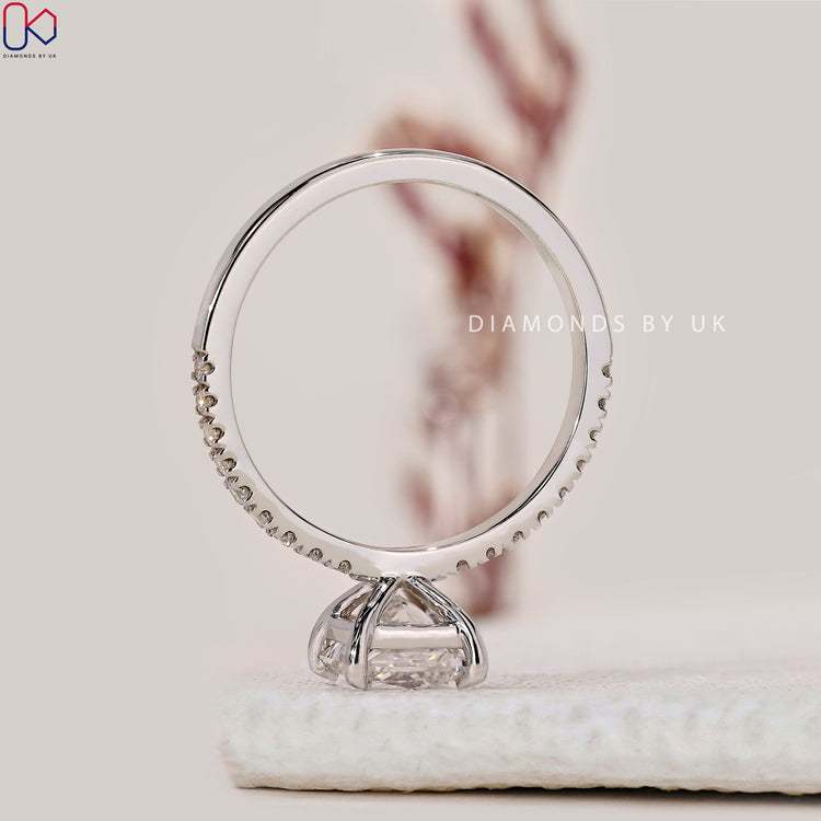 Customize ring with 4 claw prong and pave band.
