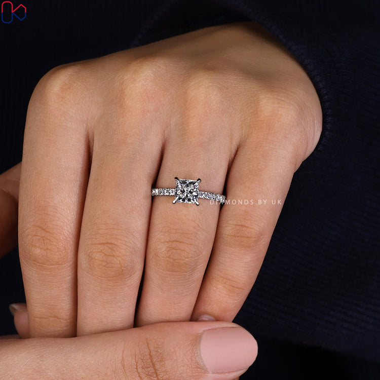 Lab grown diamond ring with princess and round stones.
