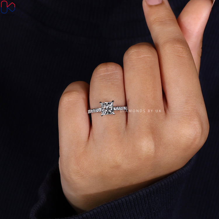 Pave setting band featuring princess cut center.
