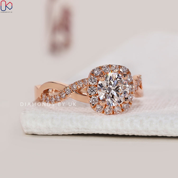 Handmade round cut engagement ring in white gold.
