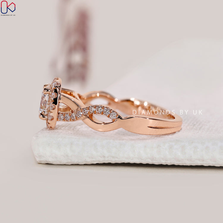 White gold halo ring with prong set round diamond.
