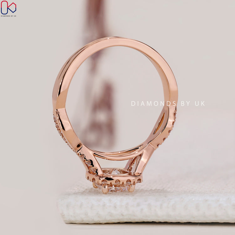 DiamondsbyUK round cut diamond ring in white gold.
