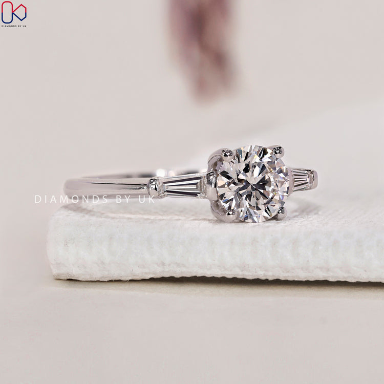 IGI certified three stone engagement ring with diamonds for verified quality.