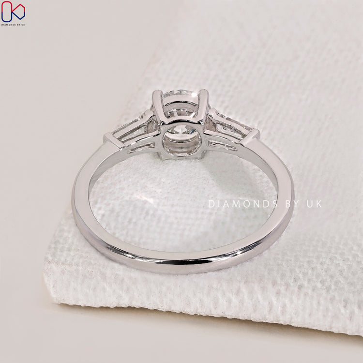 Prong setting ring featuring a stunning three stone engagement ring for maximum brilliance.