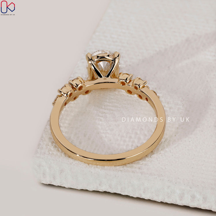 Buy engagement ring with oval cut and unique shank.
