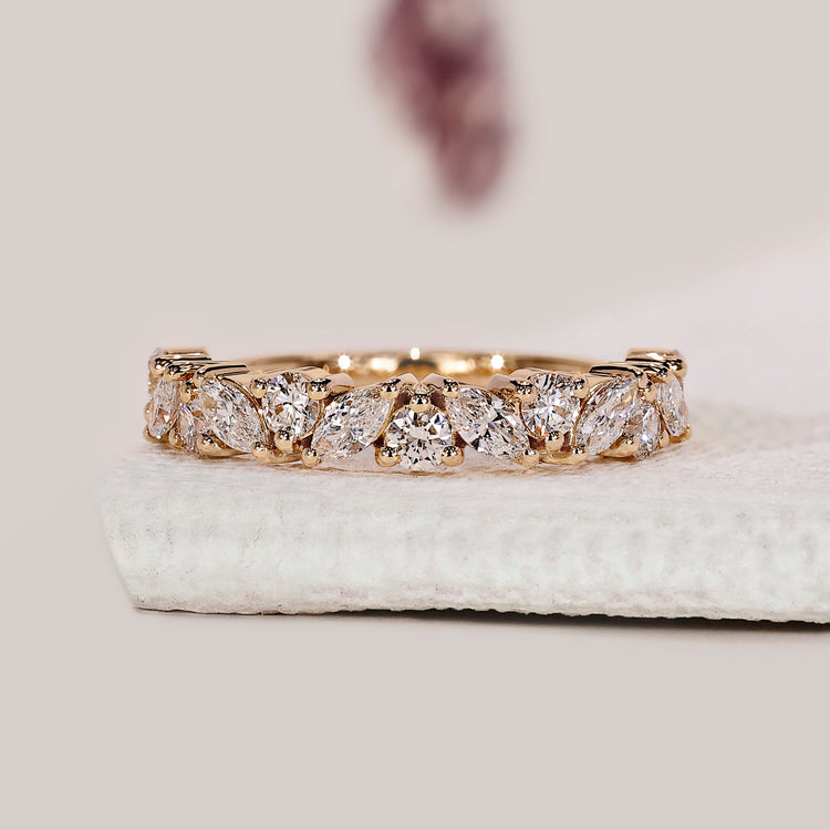 Marquise diamond wedding band crafted with alternating shapes for a standout design.
