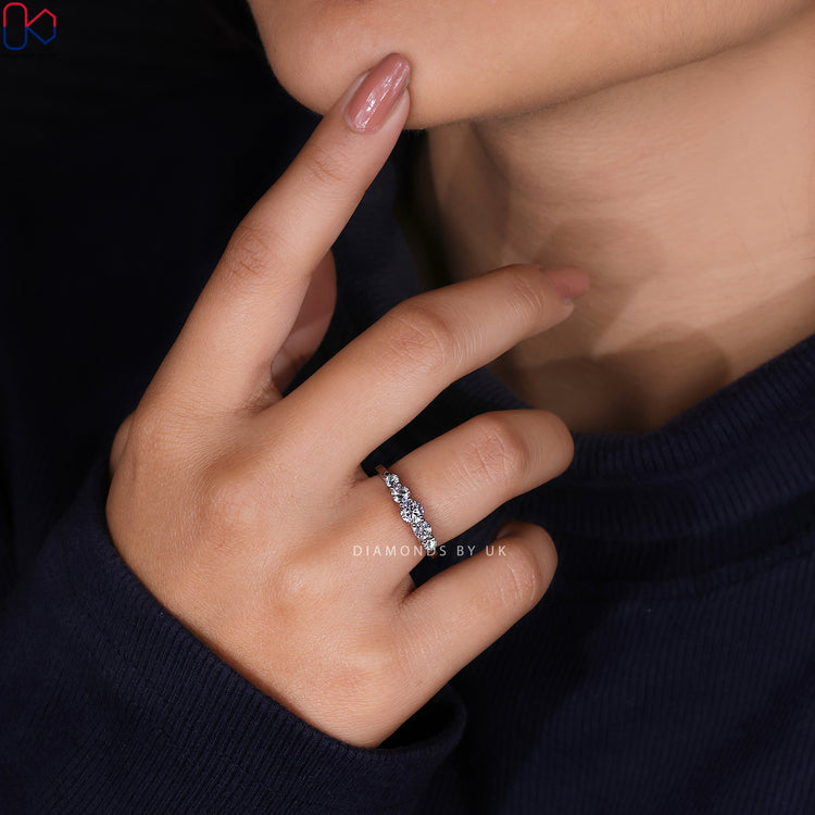 Diamondsbyuk half eternity band with round diamonds.