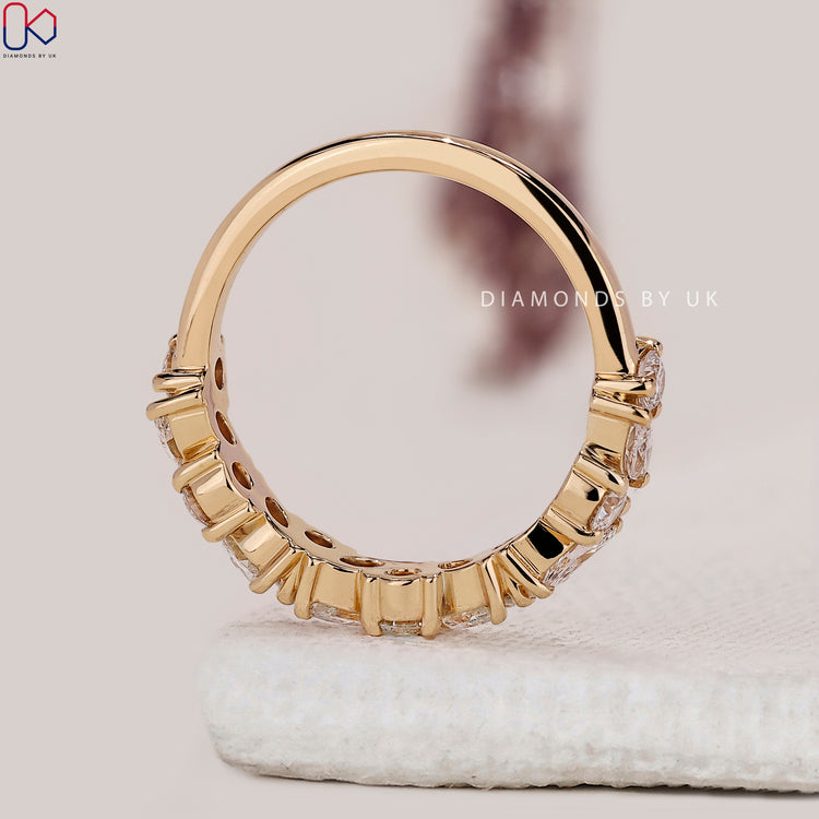 Marquise and round diamond band crafted with alternating stones for added dimension.
