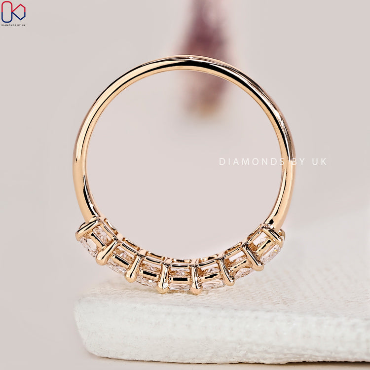 Half eternity diamond wedding band handcrafted with seven radiant lab grown stones.
