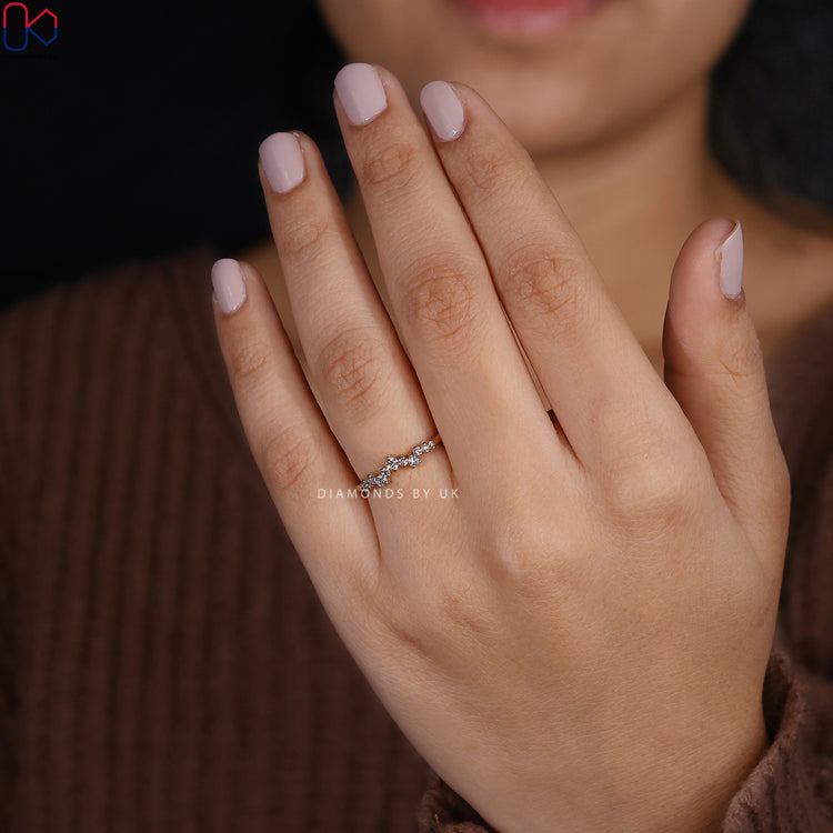 Anniversary gift her will love—a fine curvy band with round lab diamonds.

