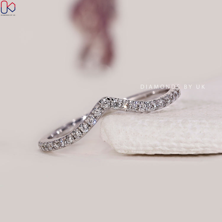Chevron wedding band featuring prong set lab grown diamonds in a soft curve.
