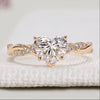 Heart cut diamond ring with twisted pavé style setting.
