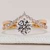 Hidden halo round cut ring with twisted pavé band.
