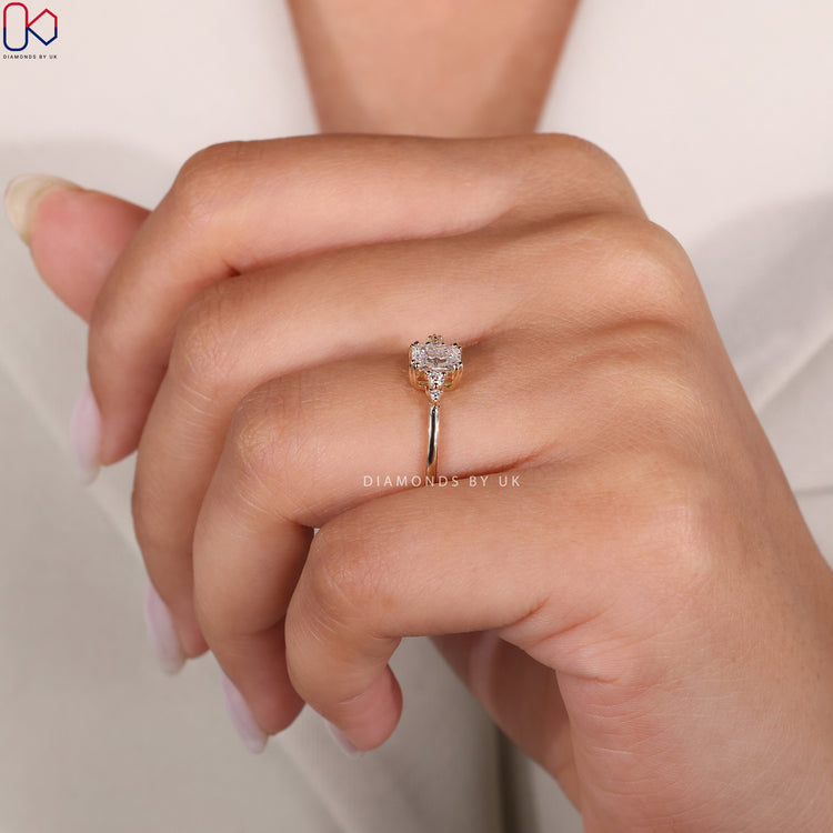 Lab grown radiant cut ring with side diamonds.
