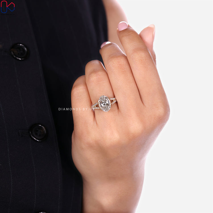 Split pavé shank oval ring with bridge accents.